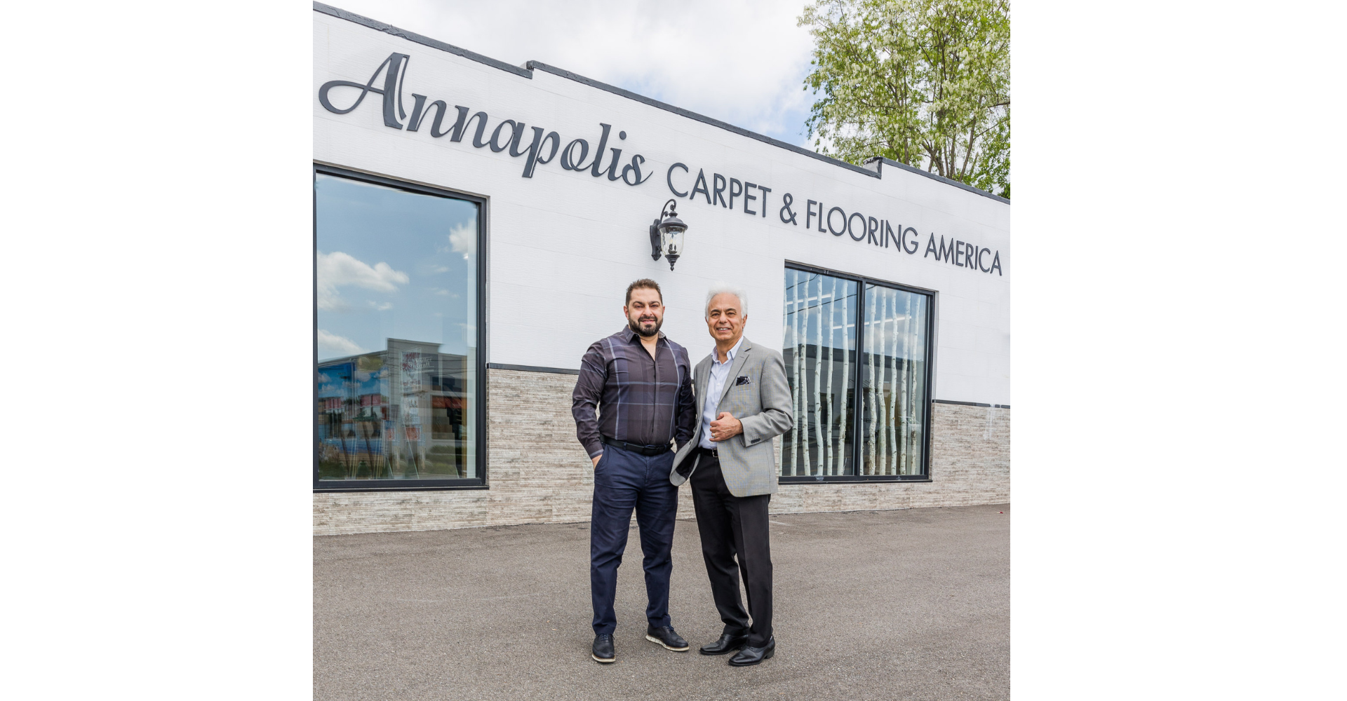 Owners in front of flooring store 